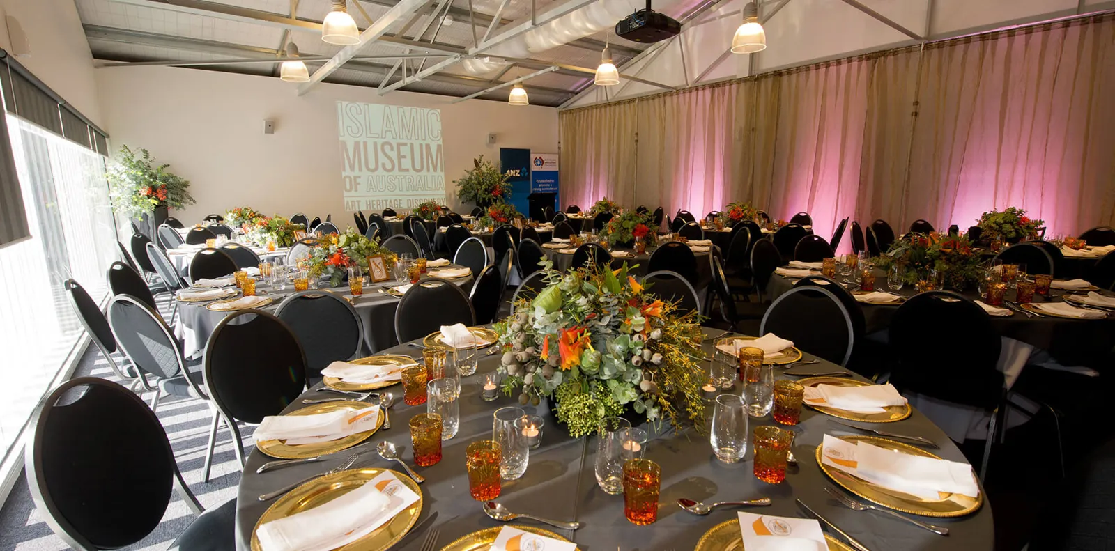 The function room set for a gala dinner with round tables