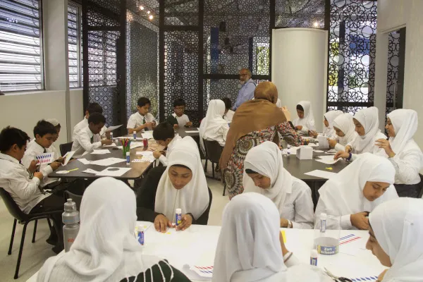 Students at tables during a workshop