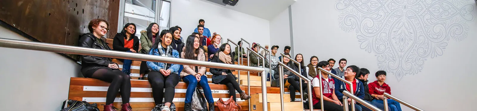 A group seated in the museum theatrette